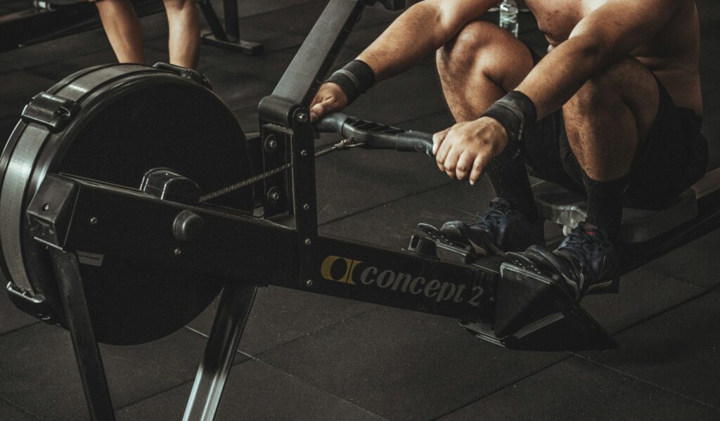 gym trainer using cardio machine